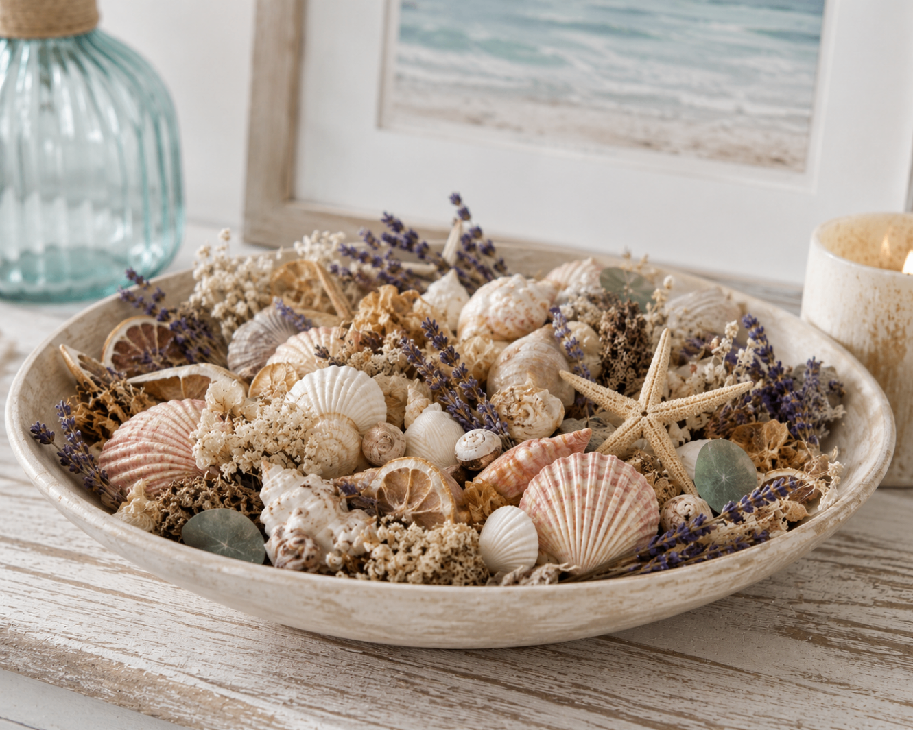 A wooden bowl of seashell potpourri with dried botanicals and lavender